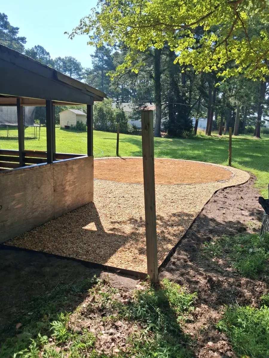 Circular gravel outdoor area, photo 1 of 12